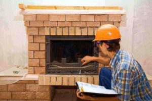 a man inspecting a chimney