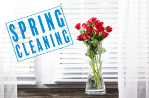 spring cleaning stamped on white blinds with red roses